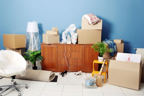 Packed boxes and furniture ready for house removals in Bow