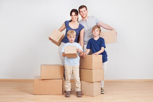 Packed household furniture ready for storage in Bow