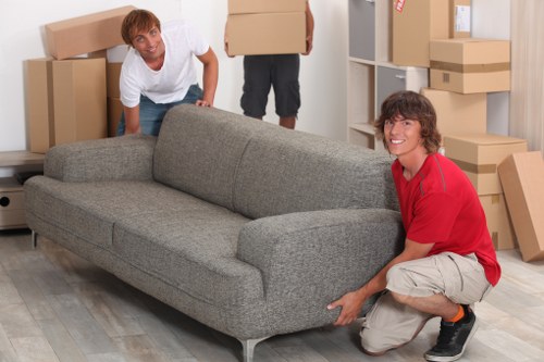 Professional movers loading boxes for a small move in Bow