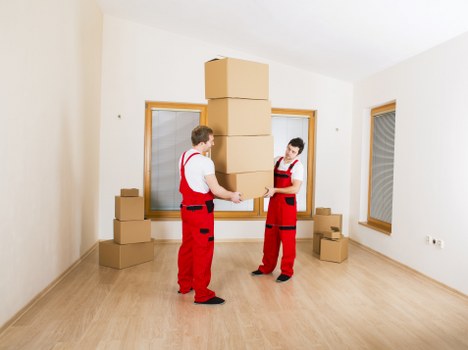 Packed boxes and furniture stored in a Bow storage unit